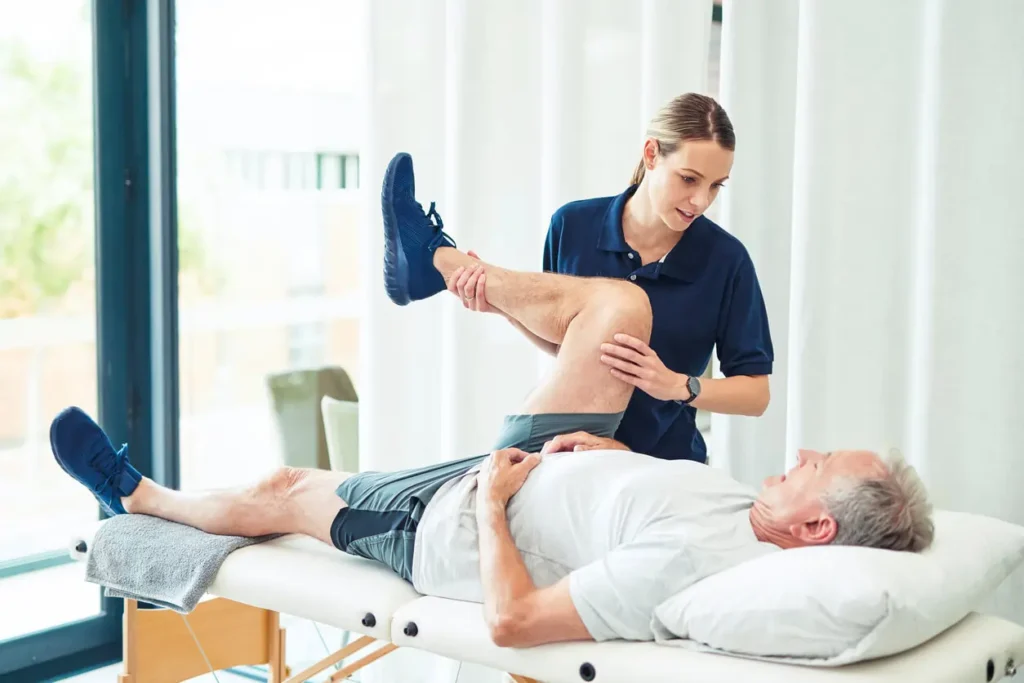 Revitalising Recovery: Effective Rehabilitation Strategies for Muscle Injuries 3 Physiotherapist assisting a patient with muscle recovery exercises Camberley