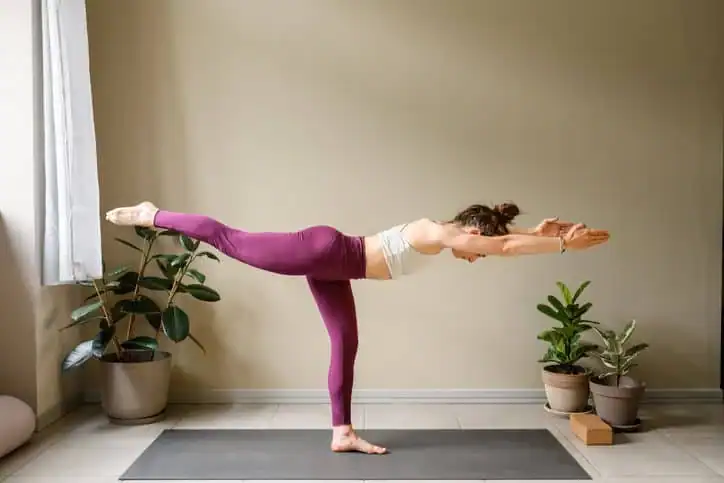 Achieving the Perfect Tone: How Often Should You Exercise for Results? 1 Woman doing Yoga exercise Camberley to help with toning the body.